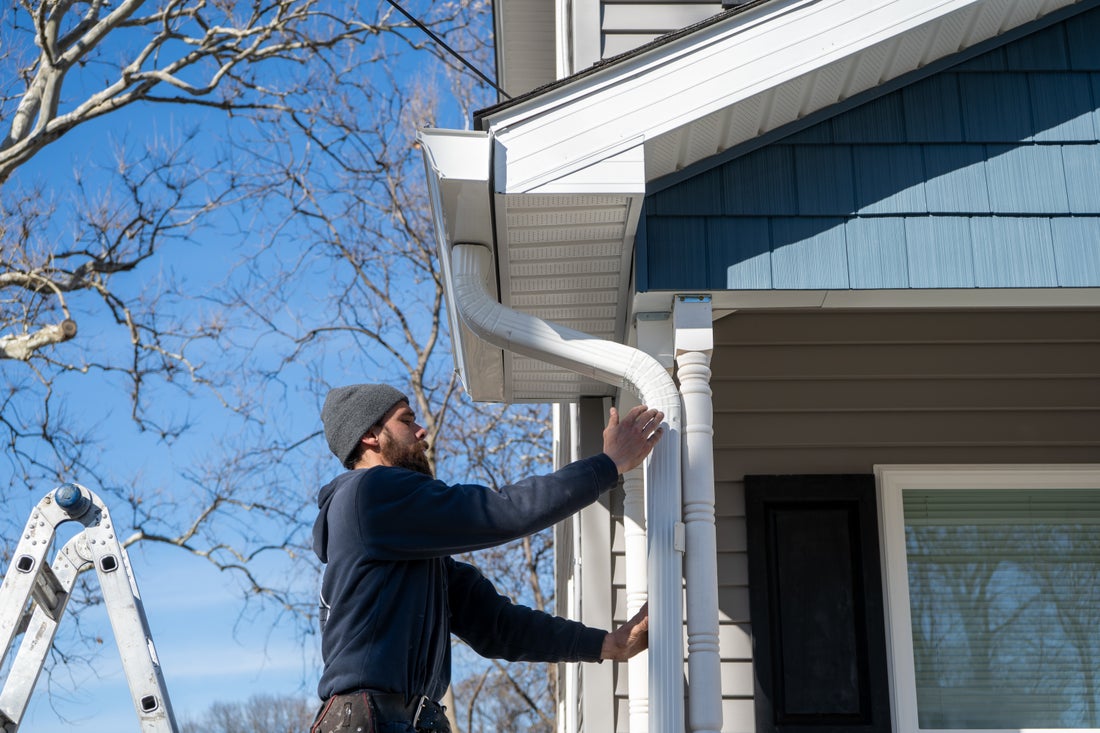 Fitting a downspout on a Hudson Valley home