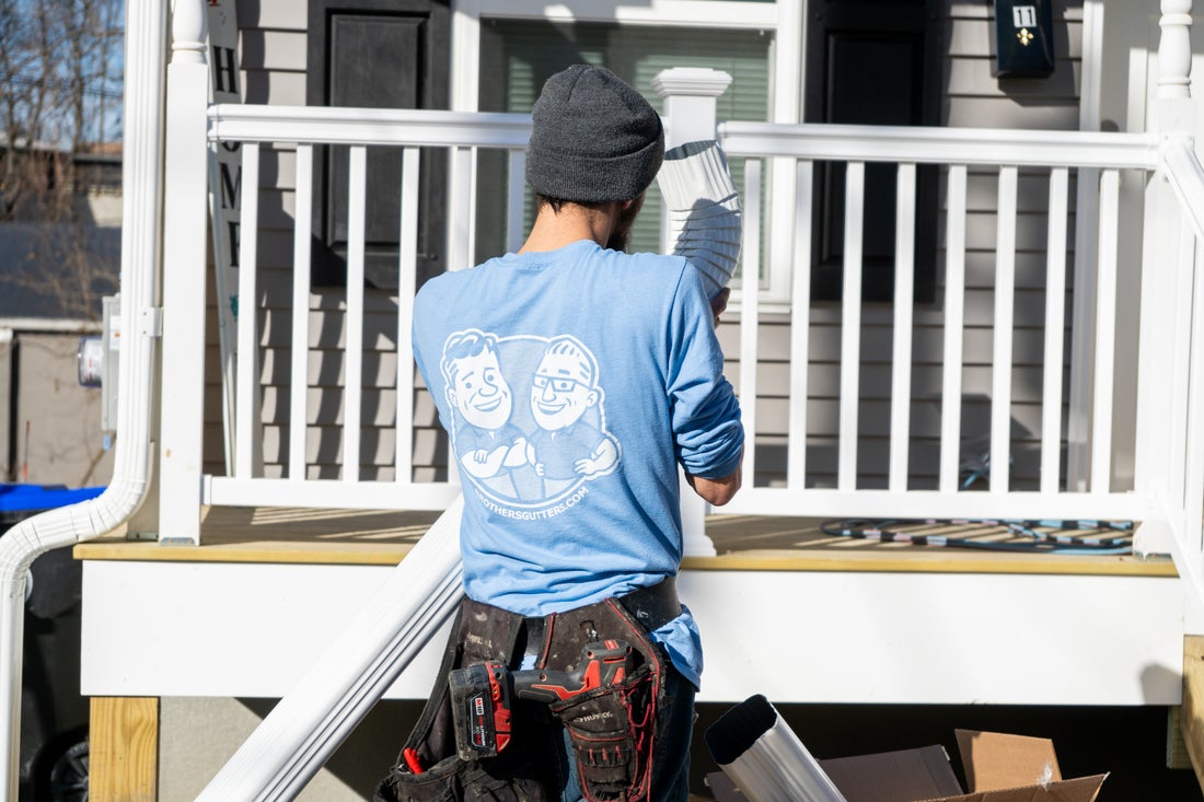 Installer working at a porch on a Hudson Valley home