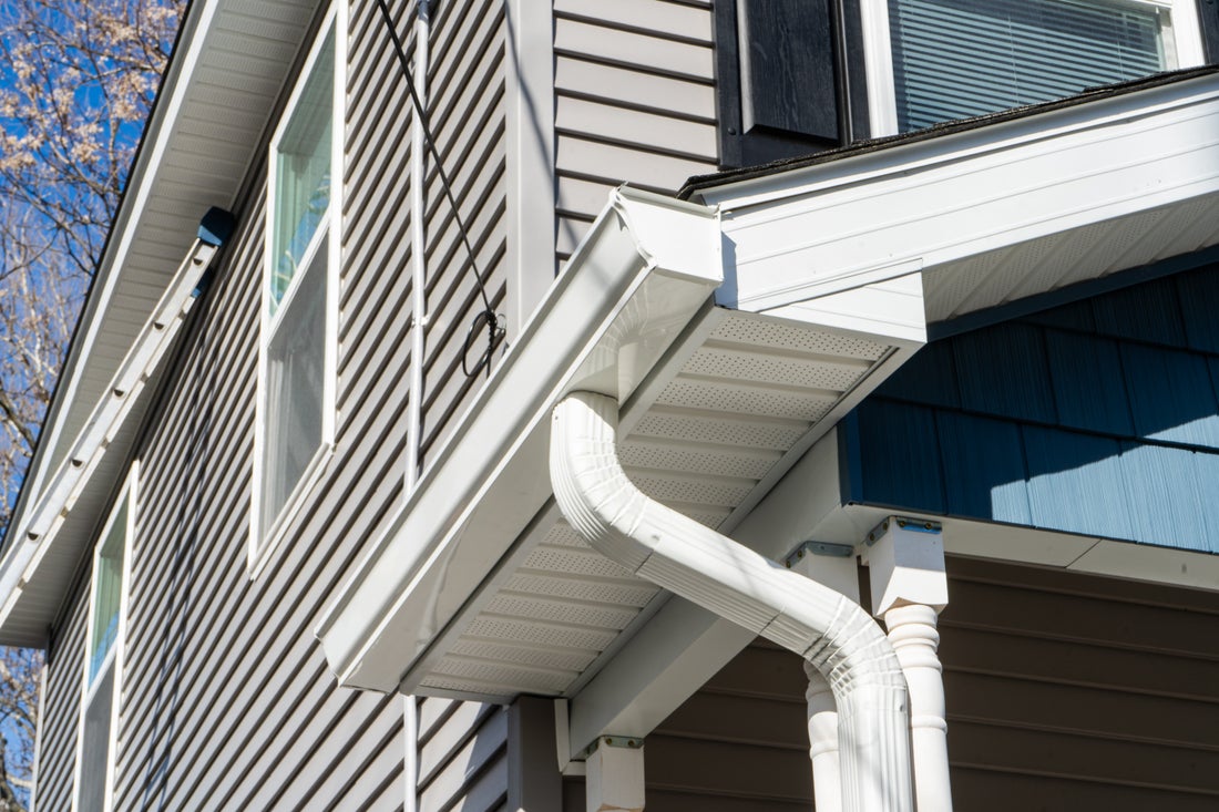 New white seamless gutter and downspout on a Hudson Valley home